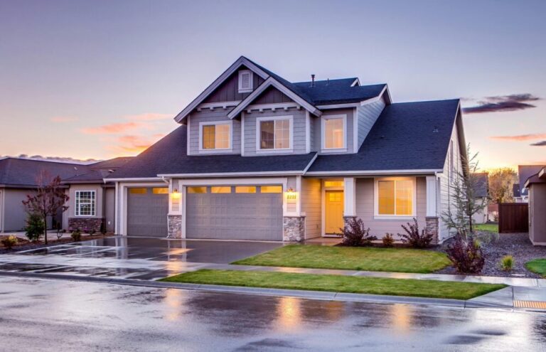 pexels-photo-186077-186077 Elegant suburban home with driveway at sunset showcasing modern architecture.
